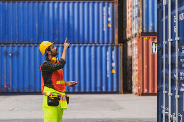 A foreman working at Container yard for logistics import export shipping concept