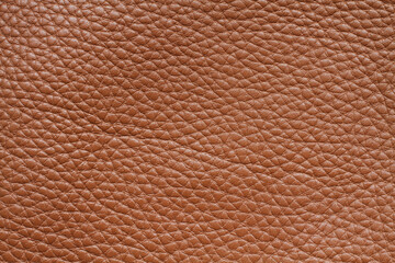 Light brown colored cow leather texture. Closeup