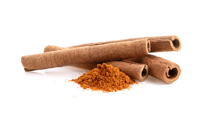 cinnamon sticks stacked on white background