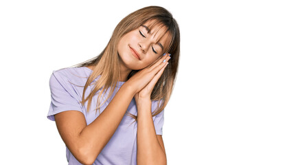 Naklejka premium Teenager caucasian girl wearing casual clothes sleeping tired dreaming and posing with hands together while smiling with closed eyes.