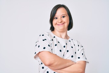 Brunette woman with down syndrome wearing casual clothes happy face smiling with crossed arms...