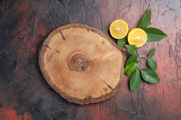top view brown wooden deksk with lemon on dark background fruit photo dark