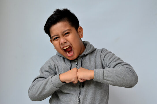 Potrait Of Asian Boy With Angry Expression