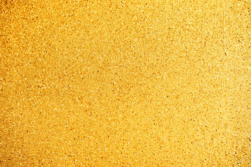 Fototapeta premium Abstract yellow background with glitter and bokeh closeup