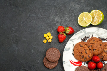 top view yummy choco biscuits for tea on the dark background tea sweet cookie sugar