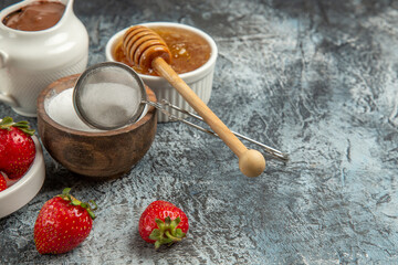 front view sweet honey with strawberries on dark background sweet honey sugar bee