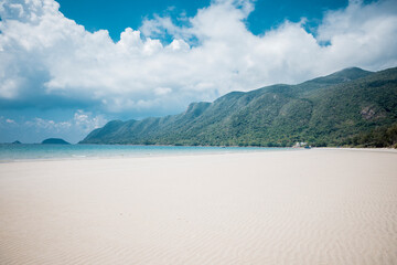 Fototapeta na wymiar Beautiful tropical beach with blue sky and white sand at Con Dao Island, Viet Nam