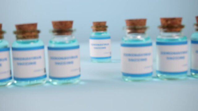 Close up moderna vaccine. Novavax, astrazeneca, biontech, pfizer. Covid vaccine. Vaccination medicine concept. Coronavirus development of virus antidote.