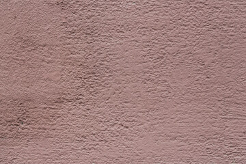 Texture of an old painted wall. Rough surface of the plastered and colored wall. Perfect for background and design. Closeup.