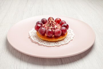 front view little cake with grapes inside plate on white background fruit dessert cake