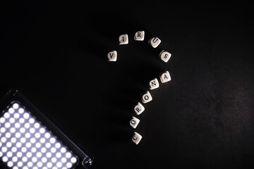 Small letters cubes the inscription "virus". On a dark background coronavirus. Director of the virus and coronavirus. World pandemic background.