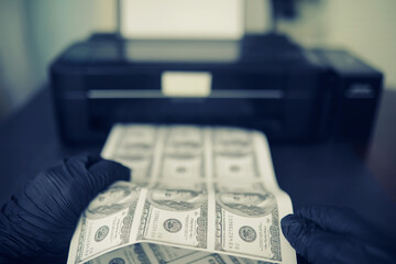The concept of the global economic crisis. Illegal production of US dollars. Print money...