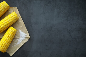 Freshly made fragrant ear of corn with salt. Farm snack of fresh corn. Healthy breakfast and...