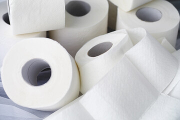 Toilet paper in a roll. Snow-white soft three-layer toilet paper. Lack of hygiene products. Primary protection and disinfection.