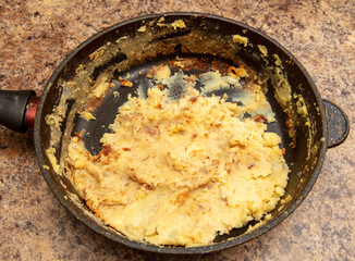 Fried potatoes in a frying pan