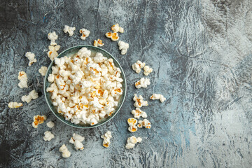 Obraz na płótnie Canvas top view fresh popcorn on light desk snack rusk cips