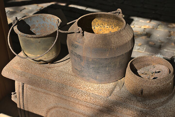 Rusty old iron kettles