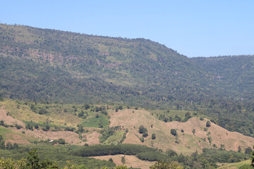 Scenery of deforested mountainous area for cash crop agriculture, non-sustainable development direction. 