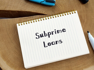 Financial concept meaning Subprime Loans with sign on the page.
