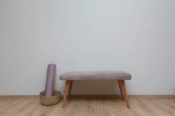front view bench standing in front of white wall