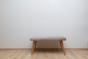 front view bench standing in front of white wall