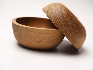Closeup picture of wooden bowl, shoot on a white isolated background