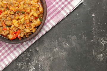 top half view roasted eggplant salad in bowl on napkin on dark background free place