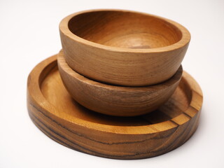 Closeup picture of wooden bowl, shoot on a white isolated background