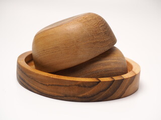 Closeup picture of wooden bowl, shoot on a white isolated background
