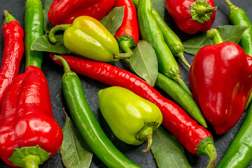 front view different fresh peppers on dark grey background diet ripe food salad