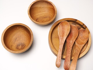 Group of antique wooden dishware that contain spoon, bowl, shoot on a white isolated background
