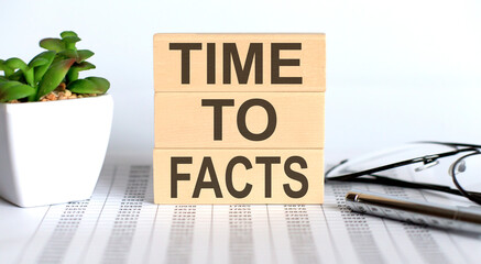 Time to facts text on wooden cubes on chart