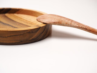 Group of antique wooden dishware that contain spoon, bowl, shoot on a white isolated background