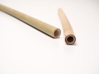 Close up shoot of a pair bamboo straw that more ecofriendly than plastic, shoot on a white isolated background