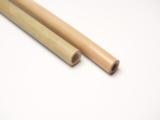 Close up shoot of a pair bamboo straw that more ecofriendly than plastic, shoot on a white isolated background