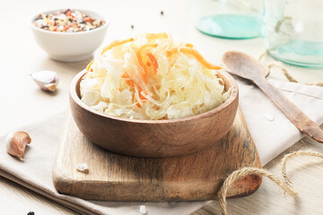 The sauerkraut is in a bowl on the table. Fermented food.