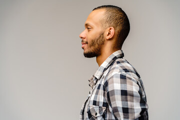 african-american young man wearing casual shirt over light grey background