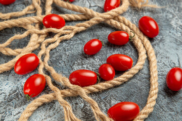 front view cherry tomatoes with ropes on light background food ripe photo salad