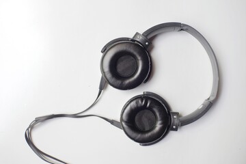 Black headphones with the casual model isolated on white