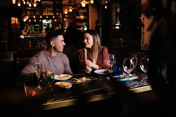 Young couple on a date at the restaurant.