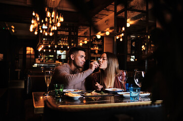 Young couple on a date at the restaurant.