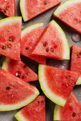 Sliced pieces of watermelon, chilled with ice, refreshing summer berry.