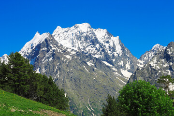 Fototapeta na wymiar Caucasus Mountains Under Snow And Clear Blue Sky