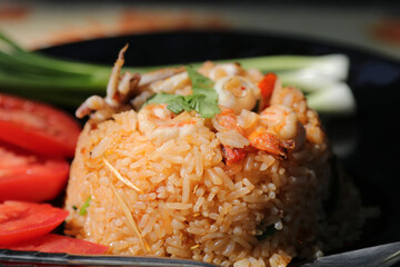Chili Paste Fried Rice Tom Yum - Squid and Shrimp - with spicy flavor is a healthy food that contains many kinds of herbs - Thai food.