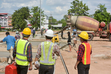 Surveyor engineer worker making measuring with theodolite on road works.survey engineer in construction site.