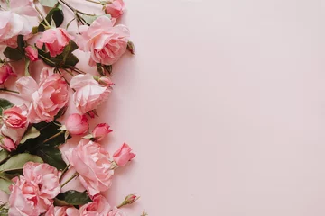 Foto op Aluminium Pink rose flowers bouquet on pink background. Flat lay, top view minimal floral composition. © Floral Deco