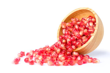 Fresh ripe red pomegranate seeds in wooden bowl isolated on white background.