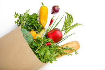 Fresh vegetables and fruits in paper bag, top view