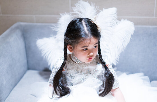 Sweet Little Angel.  Asian little girl in angel costume