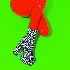 Fashion Party Girl in red .leather pants and zebra boots. Club Disco style 90s. Minimal concept